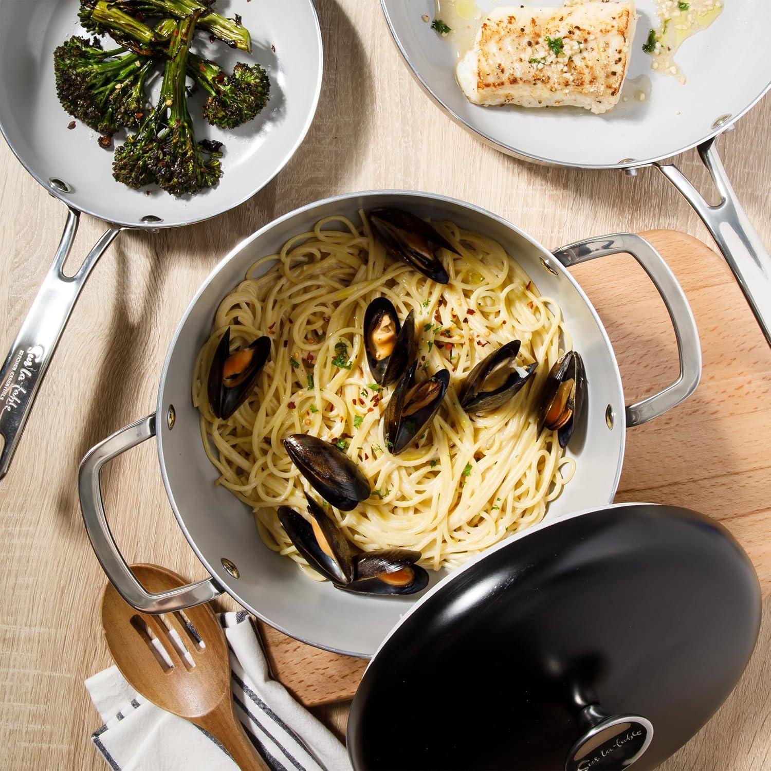 imageSur La Table Kitchen Essentials Potluck Porch 10 Piece PFA Free Ceramic Non stick Interior Forged Aluminum Cookware Pots and Pans Set WAluminum Lids Linen White Induction CompatibleBlack