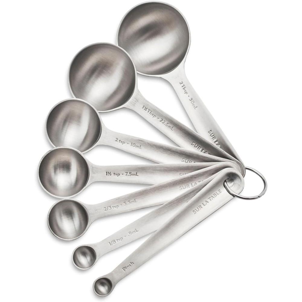 imageSur La Table Stainless Steel Measuring Spoons Set 7Piece Nesting Set with Odd Sizes Round Spoon Heads Fit Spice Jars Includes Storage Ring Dishwasher Baking Tools